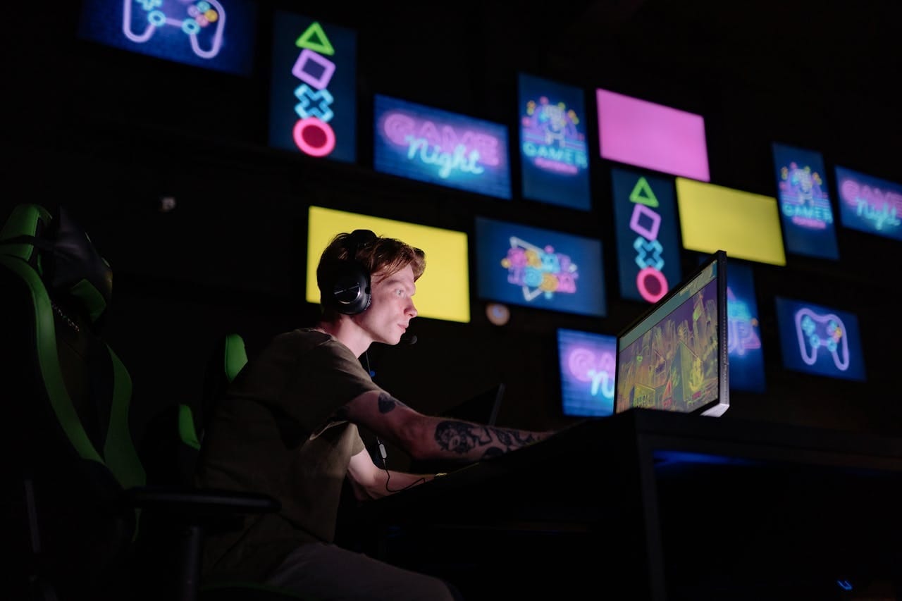 Boy playing a game in a dark room